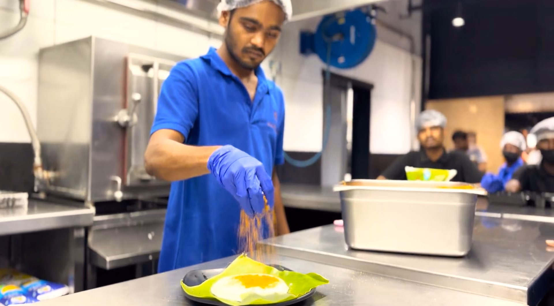 Rameshwaram Cafe Chef preparing Podi Idli.